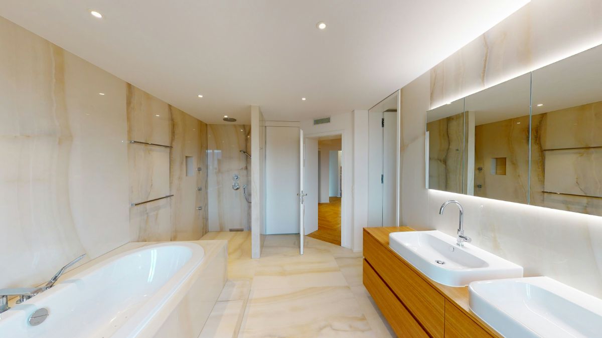 High-end bathroom transformation featuring a modern jacuzzi tub.